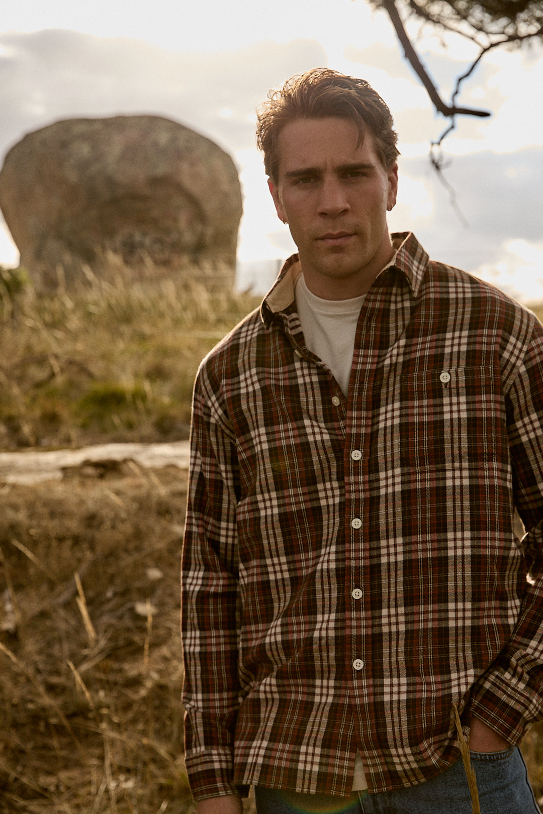 Man wearing the Pendleton Fremont Flannel Shirt in Brick/Tan Plaid outdoors